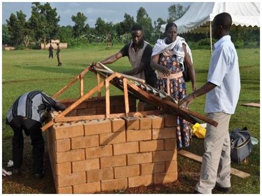 Some of the members setting up a demo unit with the products they make